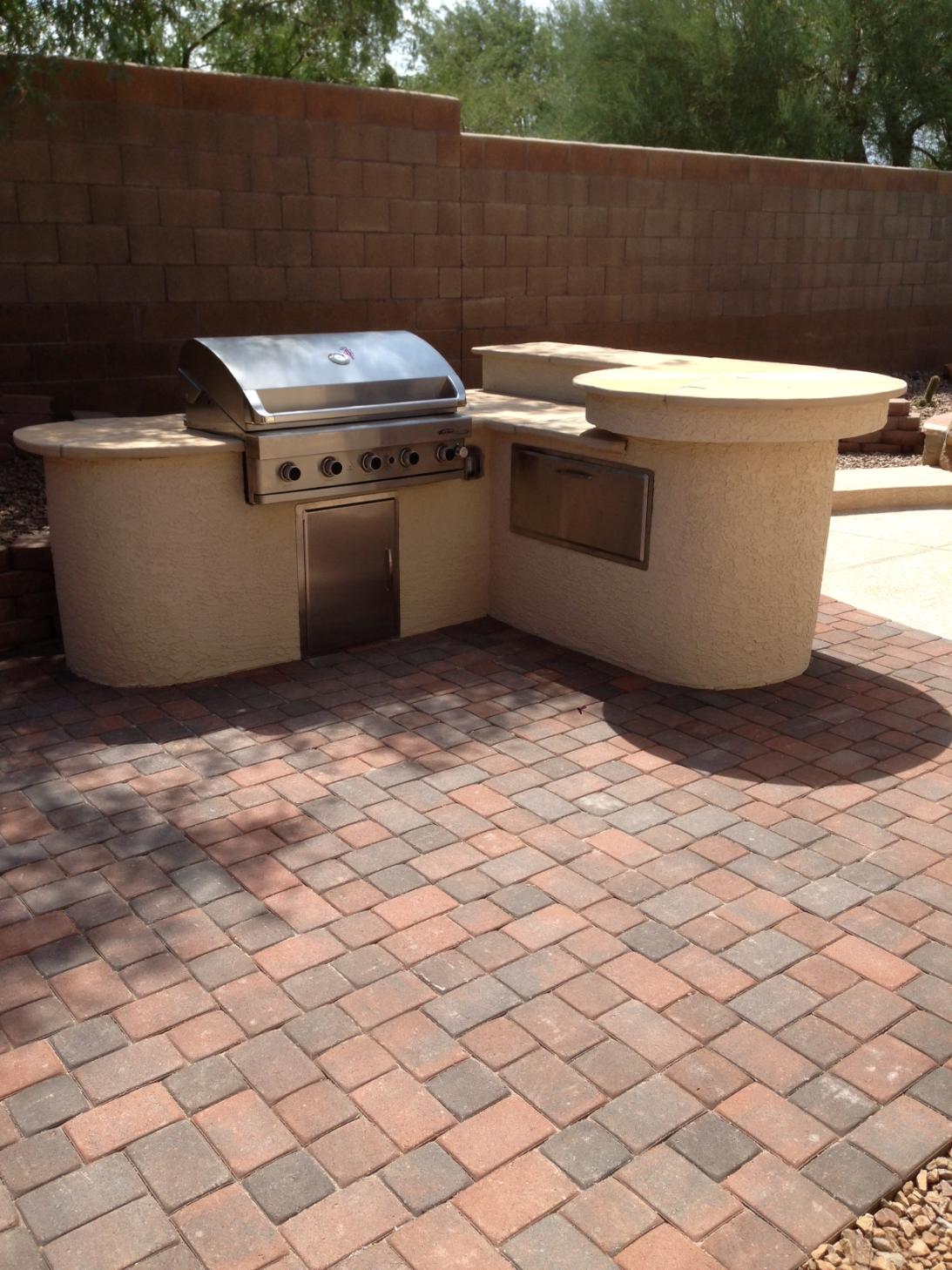 Stone patio with built-in fire pit and seating area